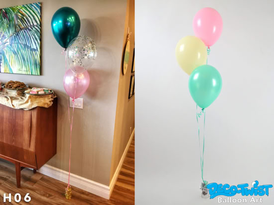 This image shows two small helium balloon bouquets: On the left, a set of three balloons: one teal, one light pink, and one clear balloon with colorful confetti inside. They are tied with pink ribbons and anchored by a gold balloon weight. On the right, another set of three balloons: one pink, one pastel yellow, and one mint green. These are tied with green ribbons and anchored by a silver balloon weight. Both bouquets are light, festive, and perfect for spreading color around gatherings or parties.