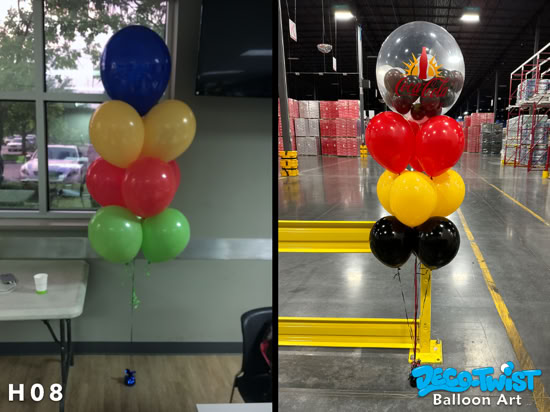 This image shows two colorful helium balloon bouquets: On the left, a layered cluster of ten balloons in solid colors—blue, yellow, red, and green—tied together and anchored with a small shiny blue weight on the floor. On the right, a layered bouquet themed with Coca-Cola branding. At the top is a clear balloon with the Coca-Cola logo and smaller balloons inside, followed by clusters of red, yellow, and black balloons. This bouquet is also tied down to keep it in place. Both arrangements are festive and suitable for parties or promotional events.